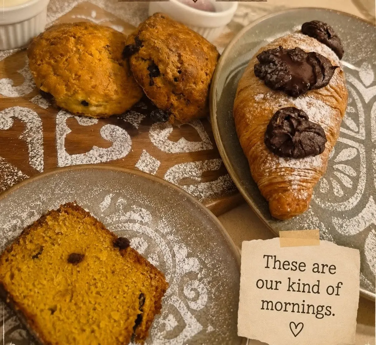 Morning pastries: scones, a chocolate-filled croissant and cake by the slice